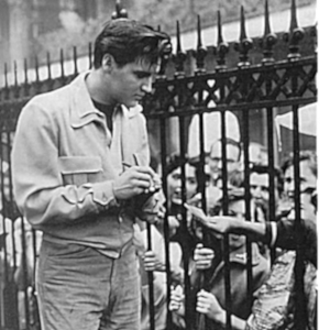 Elvis with fans at the gates of Graceland