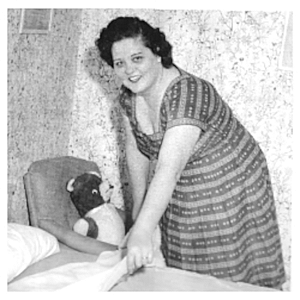 Gladys fixing up Elvis' bed