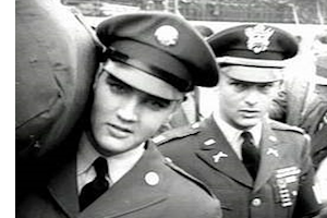 Elvis carrying duffle